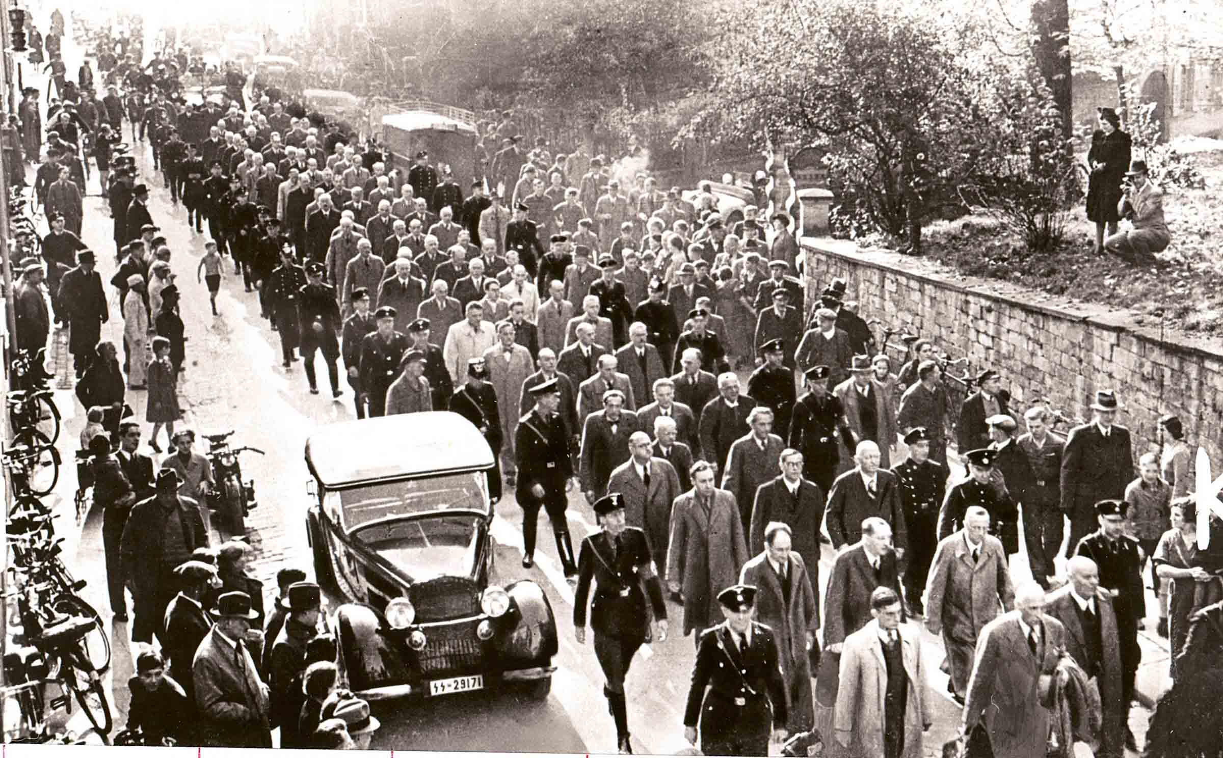 SS men and police take away the Jewish men they have arrested in Baden. November 10, 1938